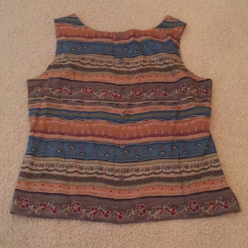 Suit with wrap around button skirt.
